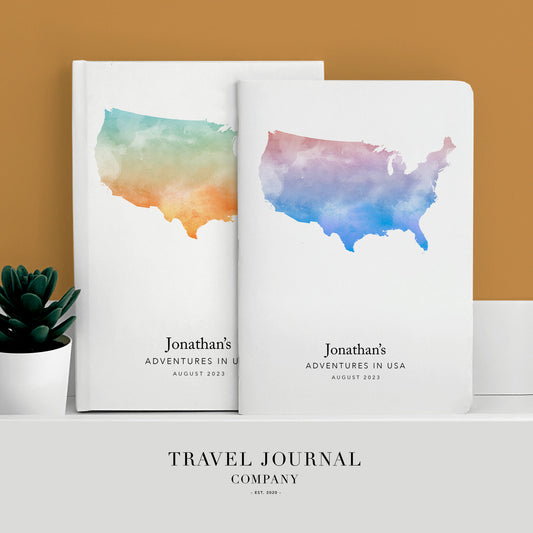 a book with a watercolor map of the united states